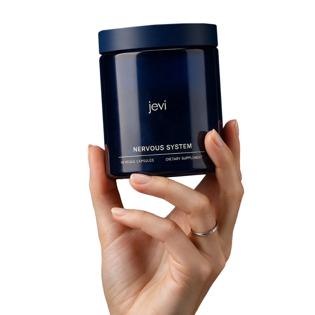 A hand holding a jar of Jevi Nervous System